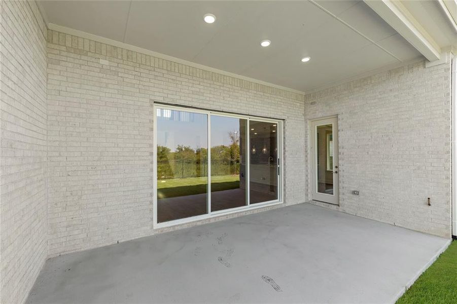 Exterior details and patio area of a home in Inspiration Collection at Union Park, Little Elm (Image 3).