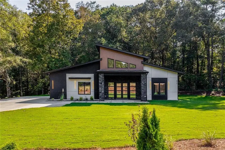 Front exterior of a new home in , Winder, GA, highlighting curb appeal (Image 2). Front exterior of a new home in , Winder, GA, highlighting curb appeal (Image 2).