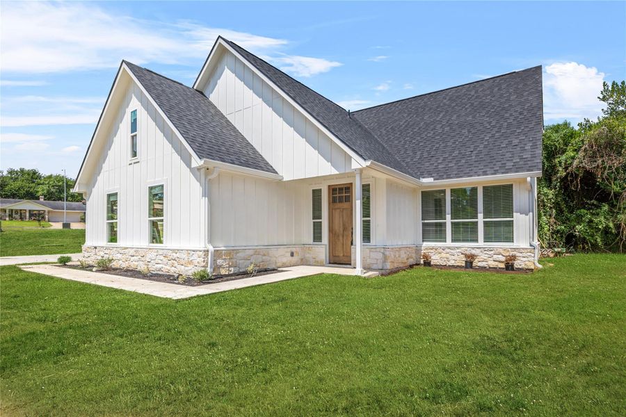 Front exterior of a new home in , Brenham, TX, highlighting curb appeal (Image 2). Front exterior of a new home in , Brenham, TX, highlighting curb appeal (Image 2).