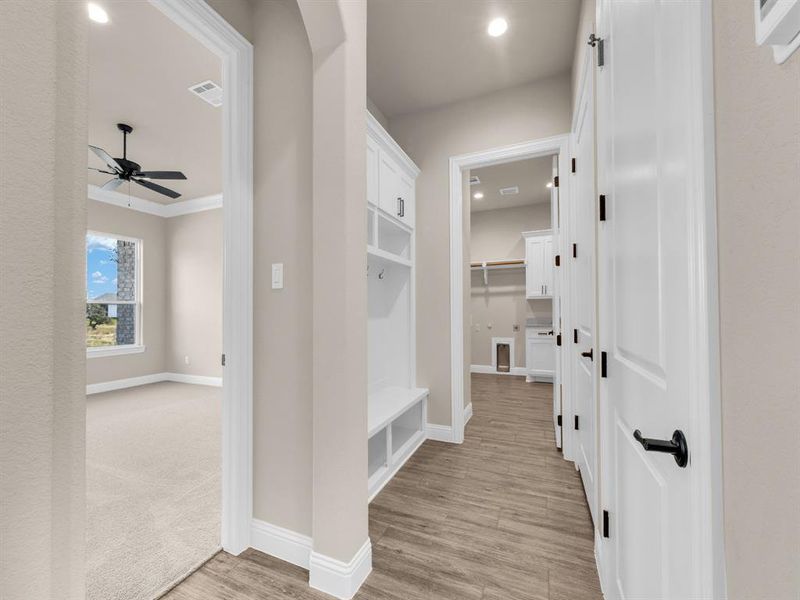 Mudroom with light hardwood / wood-style flooring and ceiling fan