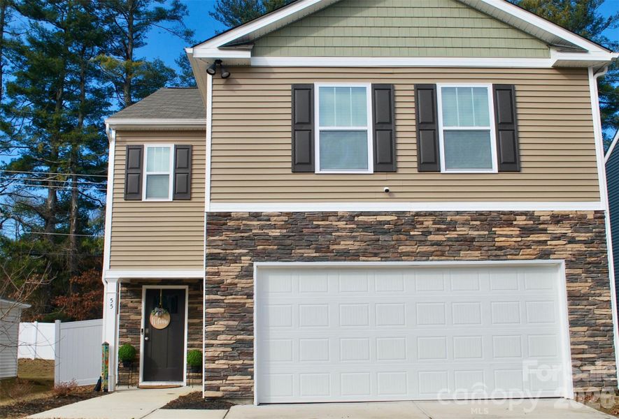 Front exterior of a new home in , Hendersonville, NC, highlighting curb appeal (Image 1). Front exterior of a new home in , Hendersonville, NC, highlighting curb appeal (Image 1).