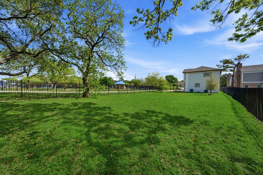 Huge fenced green space that can be utilized for hosting guests, dogs/children, grilling, etc.