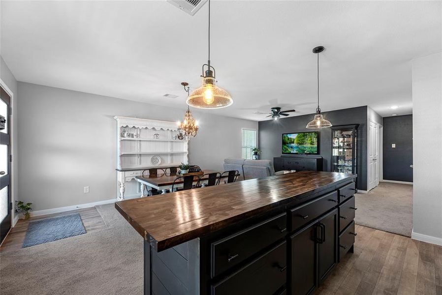 Kitchen overlooks living and dining rooms