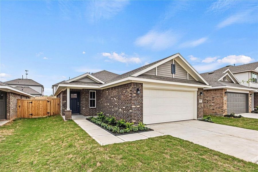 Front exterior of a new home in Bayou Maison, Dickinson, TX, highlighting curb appeal (Image 1). Front exterior of a new home in Bayou Maison, Dickinson, TX, highlighting curb appeal (Image 1).