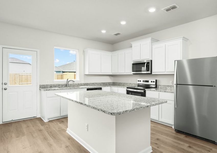 The kitchen has beautiful white wood cabinetry. The kitchen has beautiful white wood cabinetry.