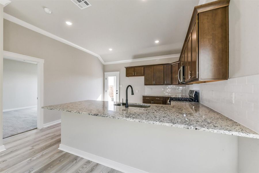 Furnished interior view inside a new home in Aldeana, Bonney (Image 10).