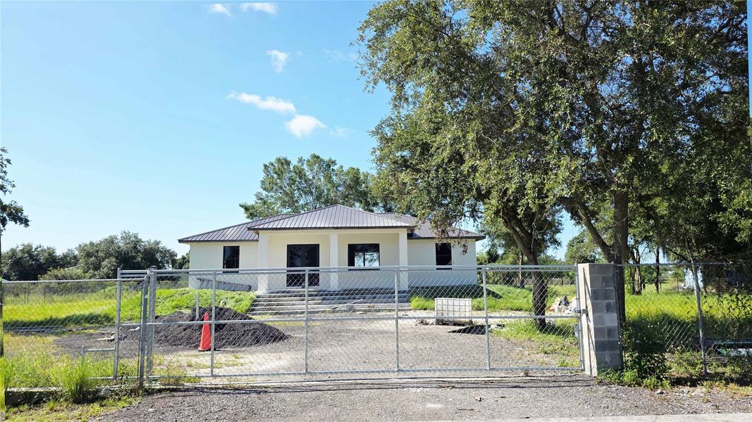 Front exterior of a new home in , Clewiston, FL, highlighting curb appeal (Image 6).