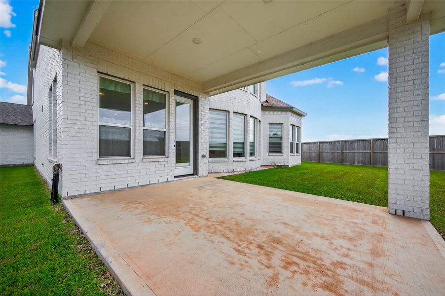 View of the extended covered patio just off the main living space—great for relaxing or grilling outdoors.