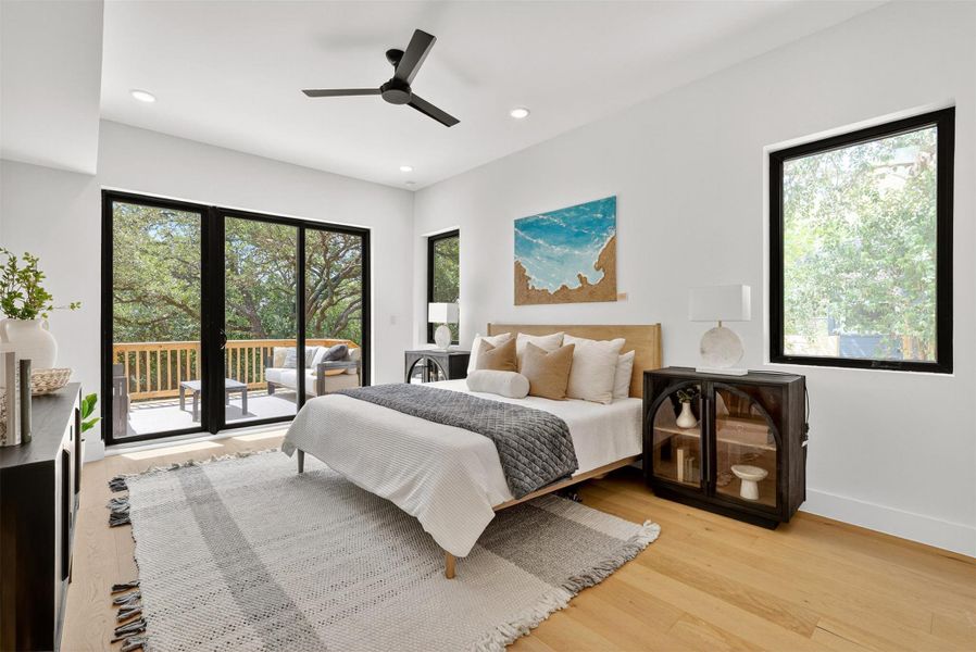 Oversized primary bedroom downstairs featuring King size bed with lots of space to the left and right of both nightstands with your very own patio sliding door with direct access to the lush backyard + sauna + cold plunge + fire pit. Oversized primary bedroom downstairs featuring King size bed with lots of space to the left and right of both nightstands with your very own patio sliding door with direct access to the lush backyard + sauna + cold plunge + fire pit.