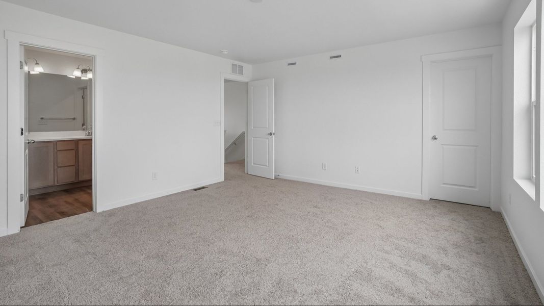 Primary bedroom with natural light and spacious layout. Primary bedroom with natural light and spacious layout.