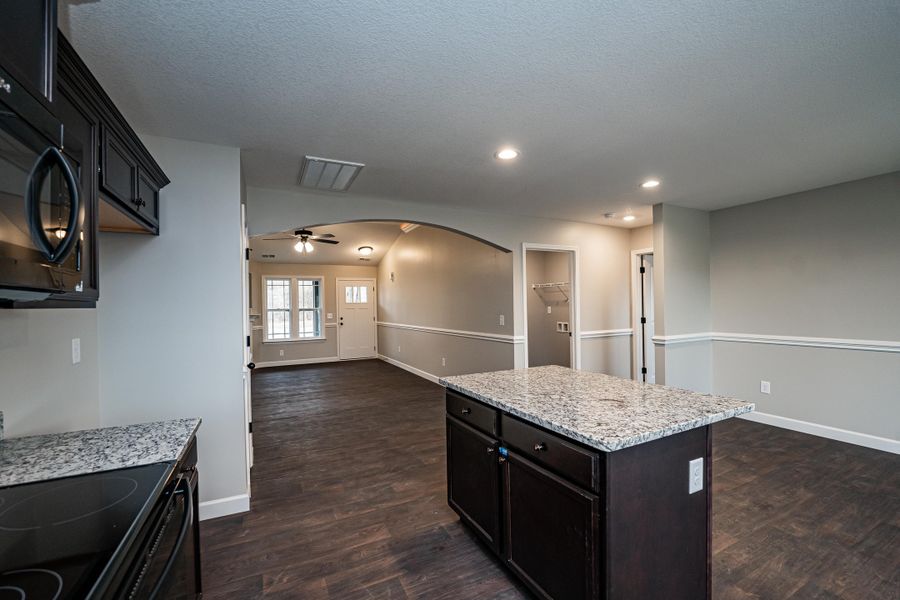 Representative furnished interior of a home built from the Saxon by Enchanted Homes in Guadalupe Heights, Seguin (Image 10).