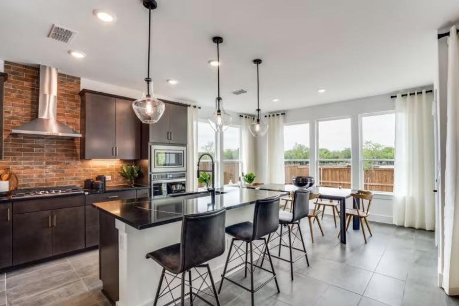 Photo of Pulte model home with same floor plan, not of actual home listed.