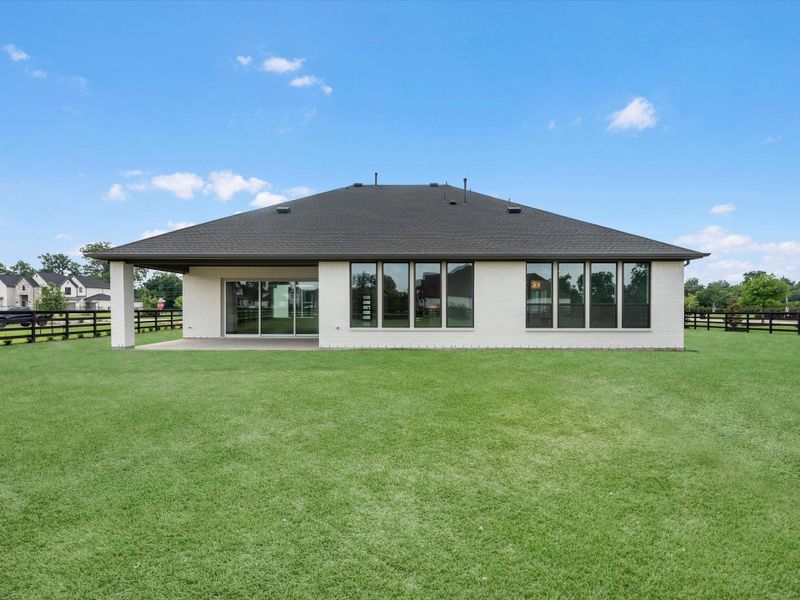 Exterior details and patio area of a home in The Estates at James Lane, Fulshear (Image 3).