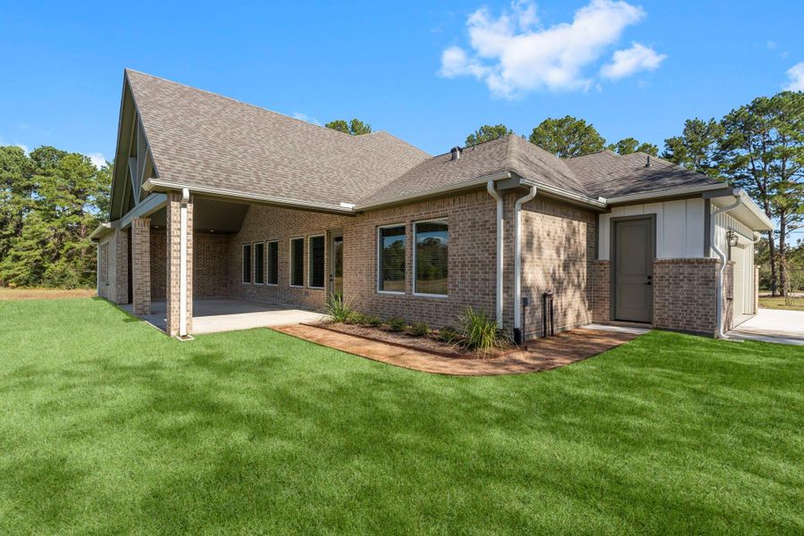 Exterior details and patio area of a home in Homestead Hill, New Waverly (Image 17).