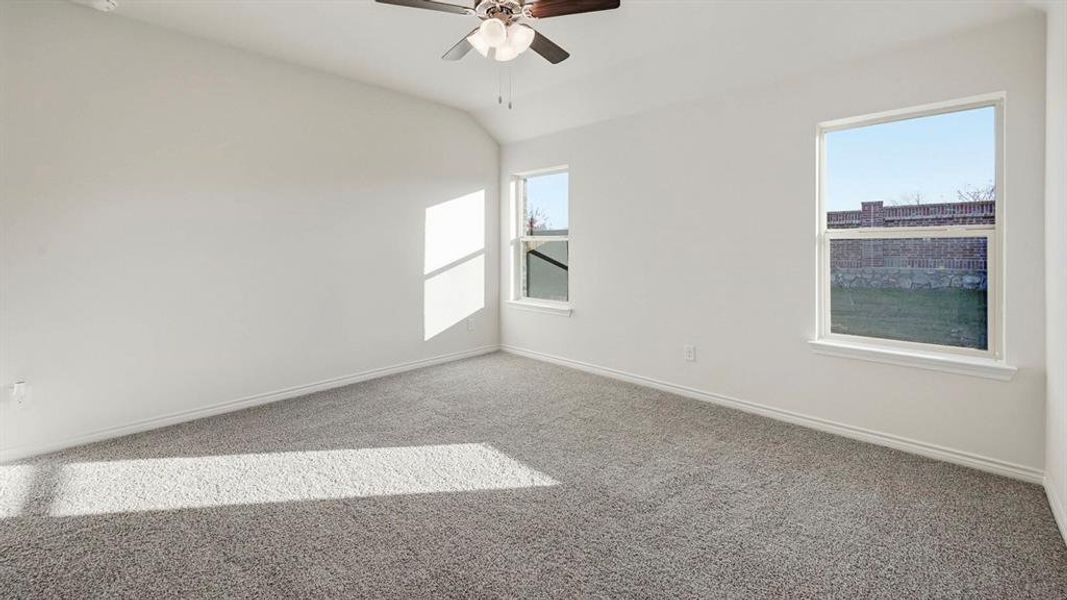 This room features light-colored walls and grey carpeting