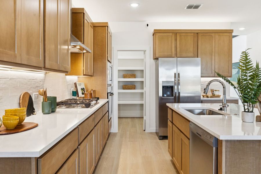 Kitchen in the Winters home plan by Trophy Signature Homes