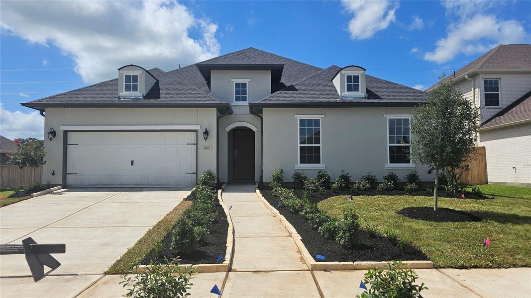 Front exterior of a new home in Sienna 65', Missouri City, TX, highlighting curb appeal (Image 2). Front exterior of a new home in Sienna 65', Missouri City, TX, highlighting curb appeal (Image 2).