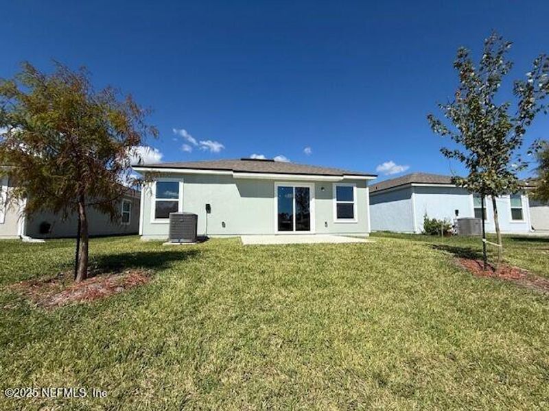 Exterior details and patio area of a home in Grand Reserve, Bunnell (Image 3).