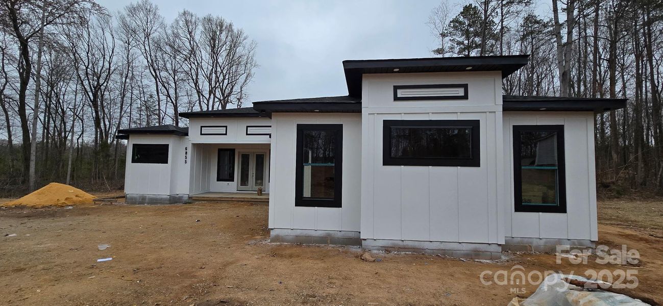 Front exterior of a new home in , Gastonia, NC, highlighting curb appeal (Image 8).