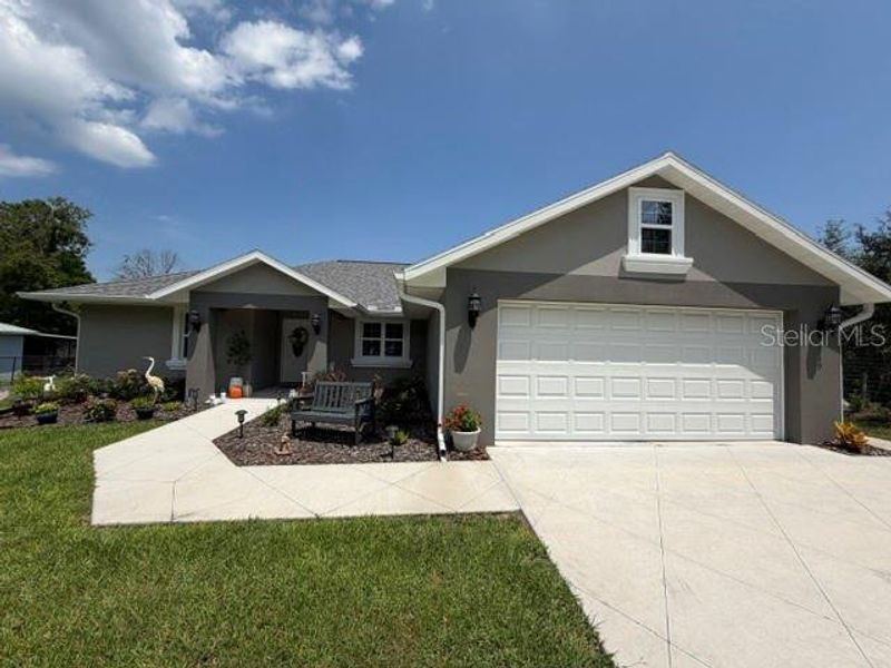 Front exterior of a new home in , Summerfield, FL, highlighting curb appeal (Image 21).