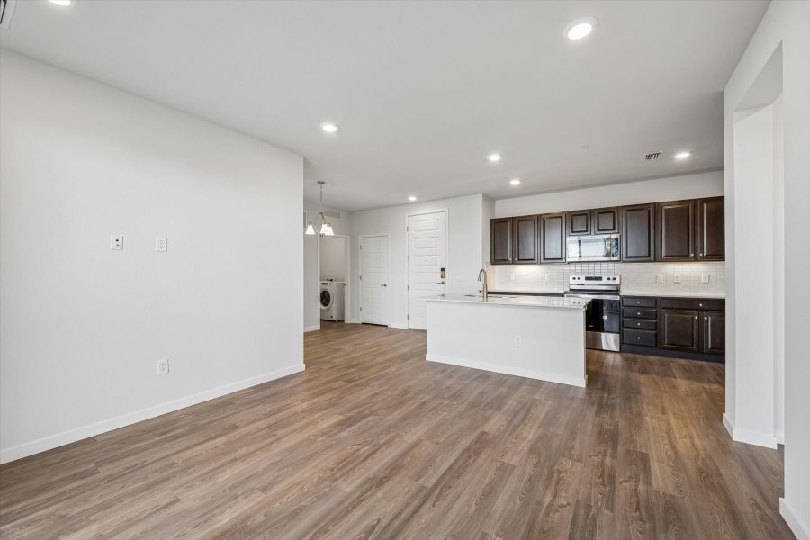 A kitchen with wooden floors.