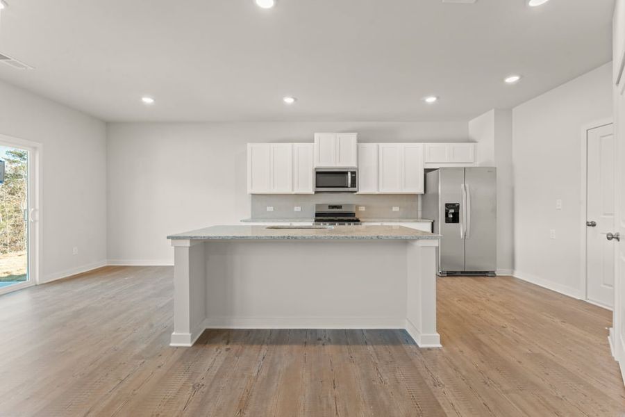 A kitchen with white cabinets. A kitchen with white cabinets.