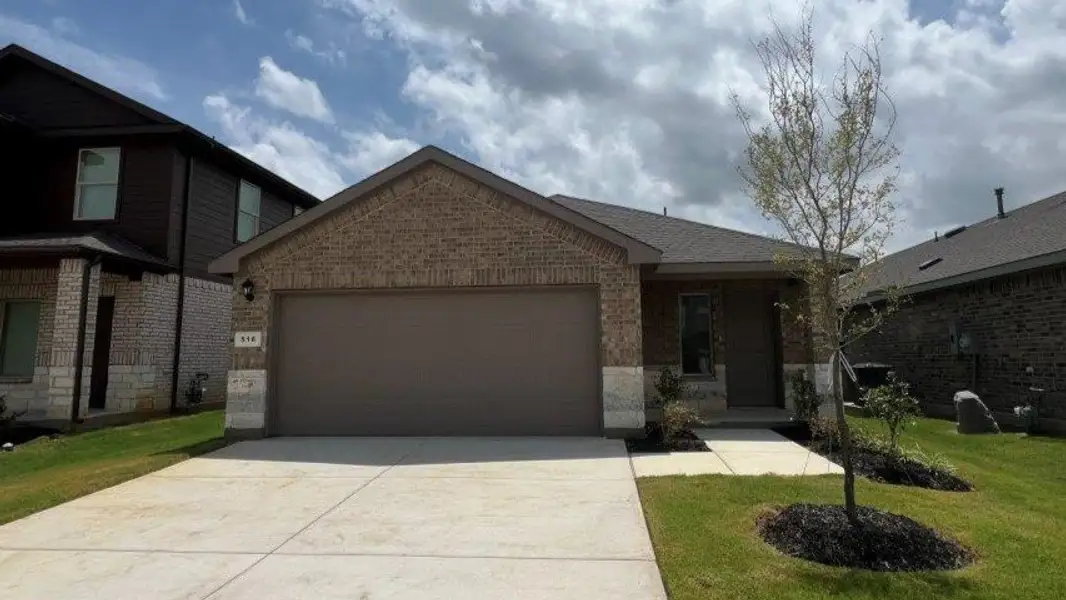Front exterior of a new home in Monarch at the Meadows, Ponder, TX, highlighting curb appeal (Image 1). Front exterior of a new home in Monarch at the Meadows, Ponder, TX, highlighting curb appeal (Image 1).