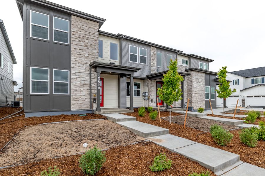 Front exterior of a new home in Painted Prairie, Aurora, CO, highlighting curb appeal (Image 21).