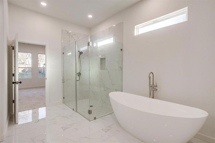 Bathroom with separate shower and tub and plenty of natural light