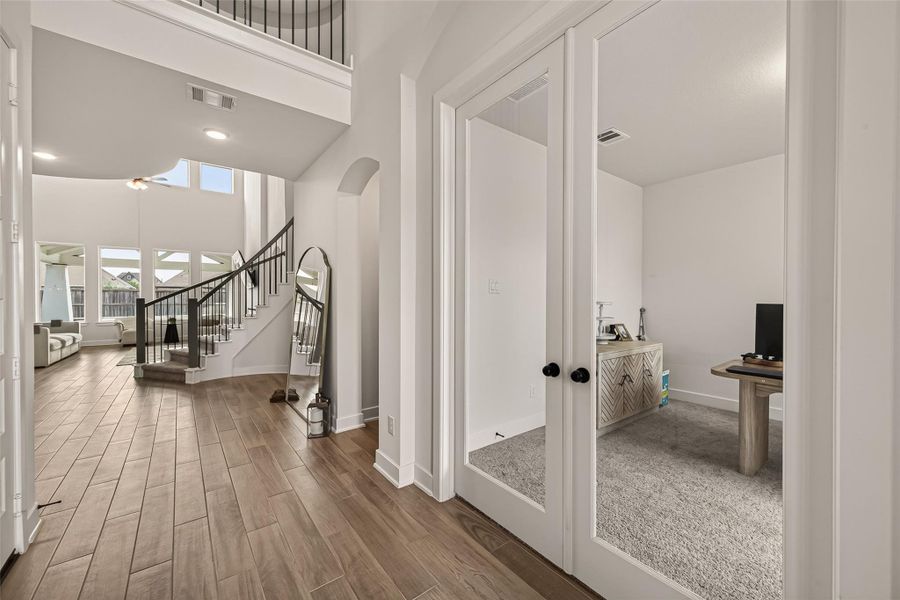 The spacious foyer showcases elegant finishes and a sweeping staircase. The spacious foyer showcases elegant finishes and a sweeping staircase.
