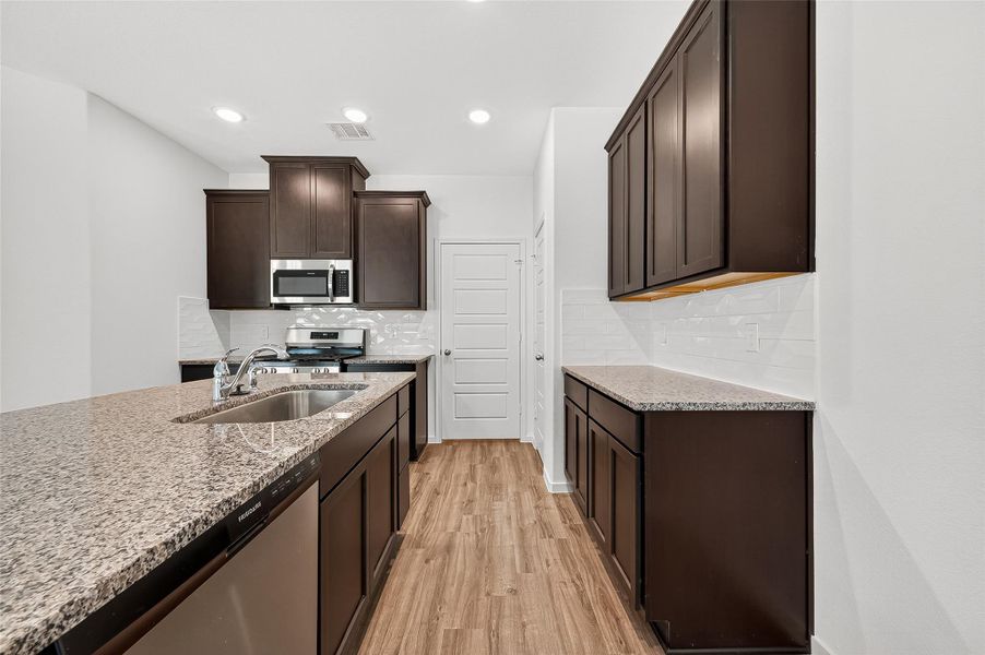 Furnished interior view inside a new home in Mill Creek Trails, Magnolia (Image 5).