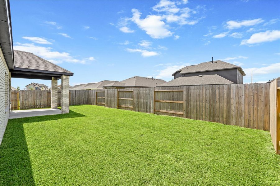 Exterior details and patio area of a home in Sunterra, Katy (Image 3).