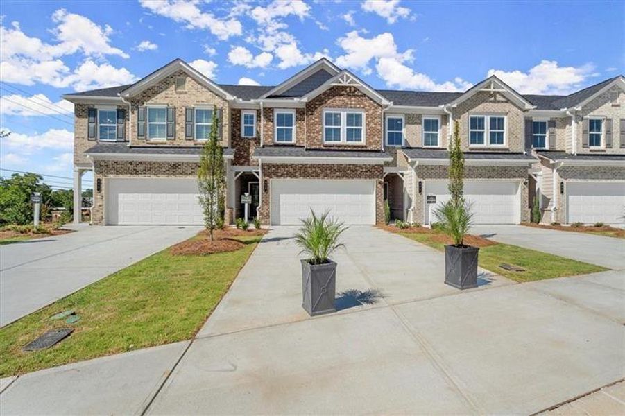 Front exterior of a new home in , Dacula, GA, highlighting curb appeal (Image 26).