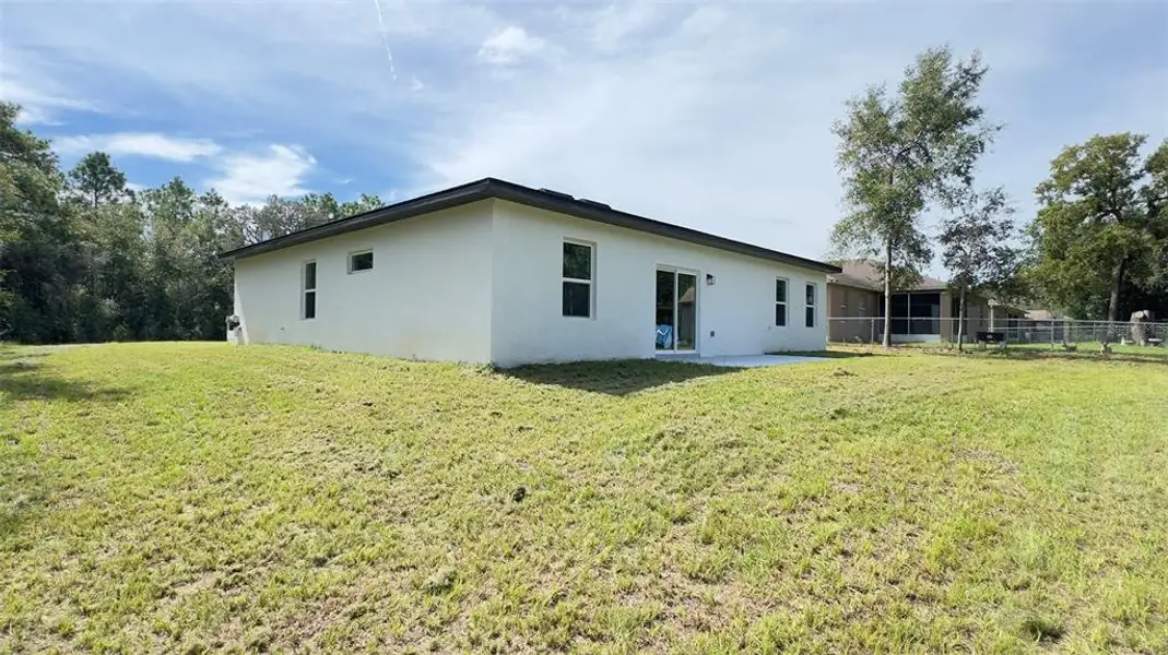 Front exterior of a new home in , Citrus Springs, FL, highlighting curb appeal (Image 1).