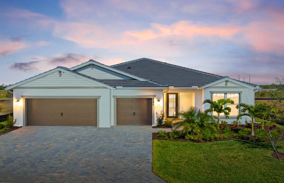 Front exterior of a new home in Del Webb Oak Creek, North Fort Myers, FL, highlighting curb appeal (Image 2).
