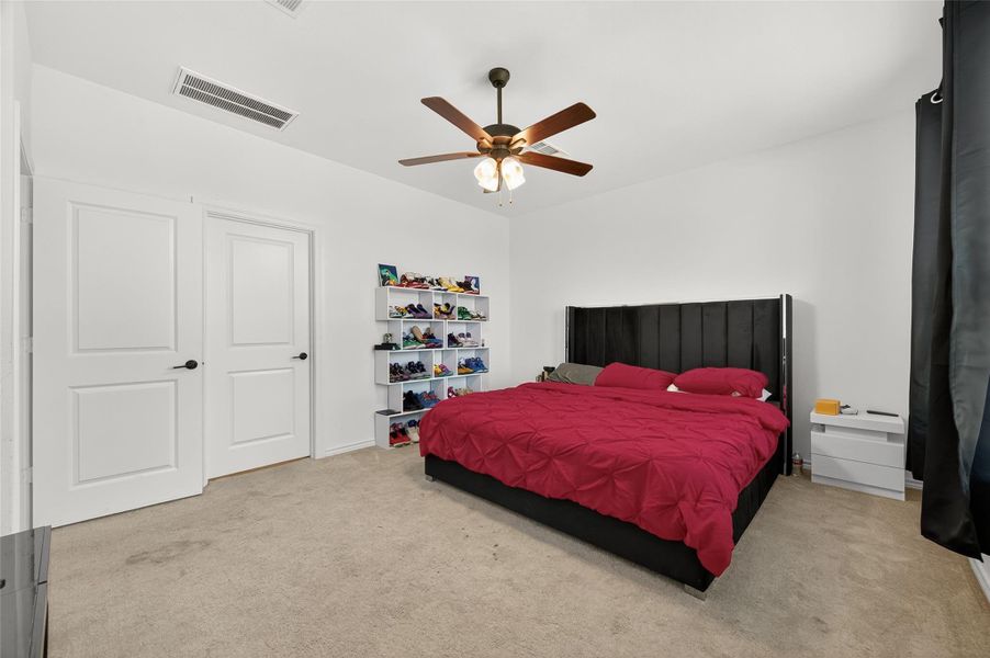 Furnished interior view inside a new home in Sunterra, Katy (Image 37).