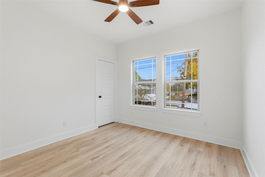 Bedroom three, includes rear-facing windows. Like bedroom two it also has a ceiling fan, and a roomy closet!