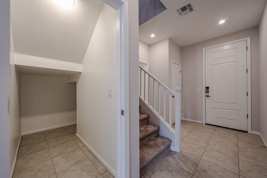 A hallway with white doors.