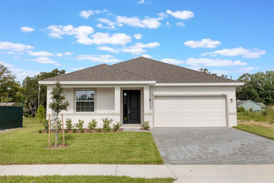 Front exterior of a new home in Grand Isle, Grand Island, FL, highlighting curb appeal (Image 1). Front exterior of a new home in Grand Isle, Grand Island, FL, highlighting curb appeal (Image 1).