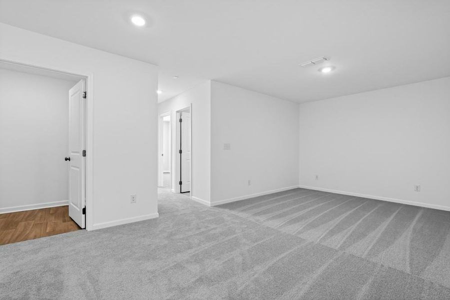 Spacious, unfurnished interior of a new home in Weatherfield, Buford (Image 30).