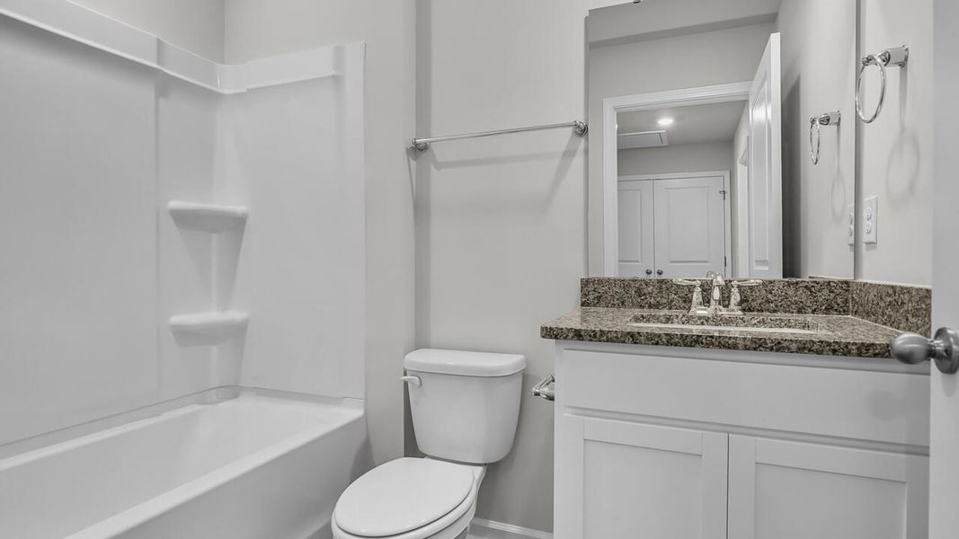 Furnished interior view inside a new home in Grayson Park Duets, Leland (Image 12).