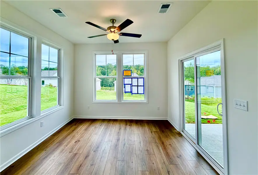 Rich wood floors and abundant windows define this
