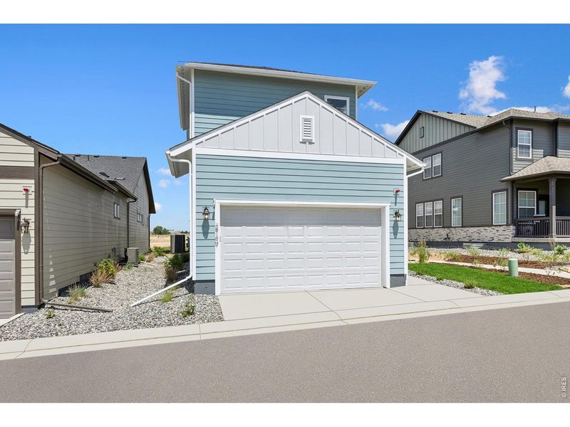 Front exterior of a new home in Kinston Cottage, Loveland, CO, highlighting curb appeal (Image 25). Front exterior of a new home in Kinston Cottage, Loveland, CO, highlighting curb appeal (Image 25).