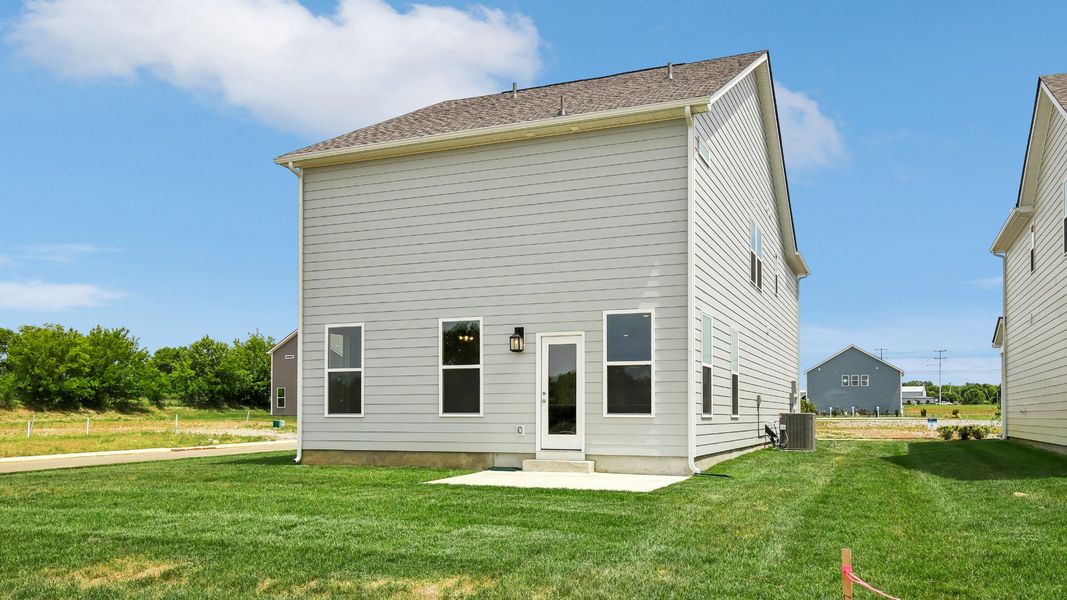 Large Backyard of home with small back patio