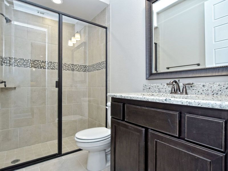 Representative furnished interior of a home built from the Madera II by Giddens Homes in Scofield Farms Estates, Georgetown (Image 252).