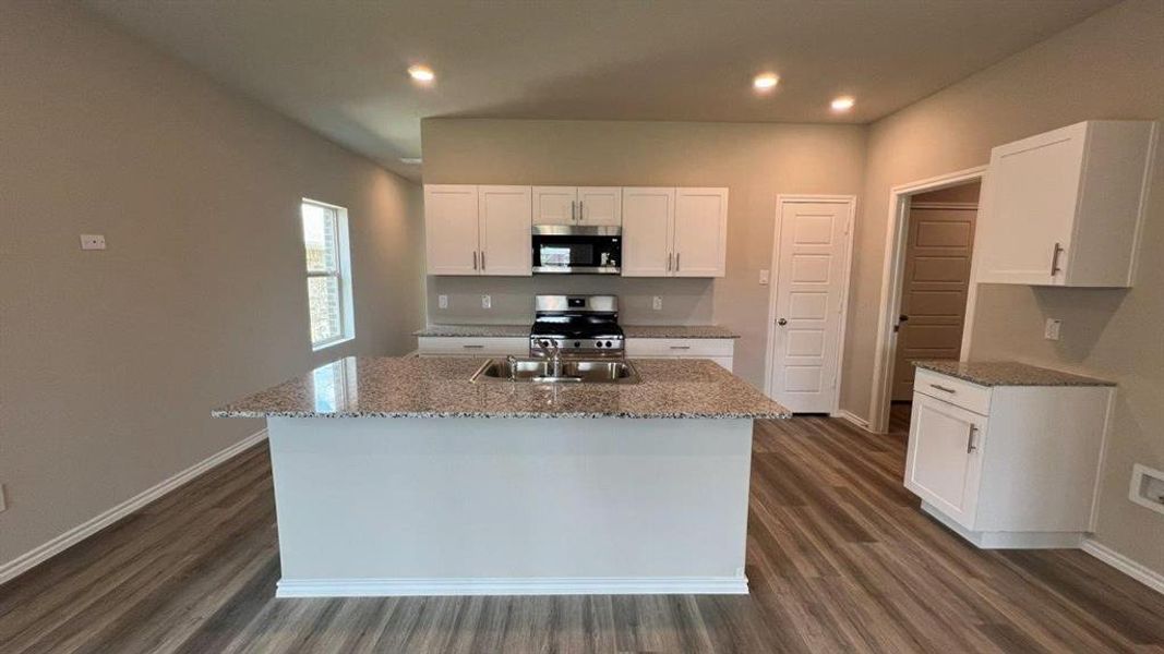 Kitchen-All Home and community information, including pricing, included features, terms, availability and amenities, are subject to change at any time without notice or obligation. All Drawings, pictures, photographs, video, square footages, floor plans, elevations, features, colors and sizes are approximate for illustration purposes only and will vary from the homes as built.