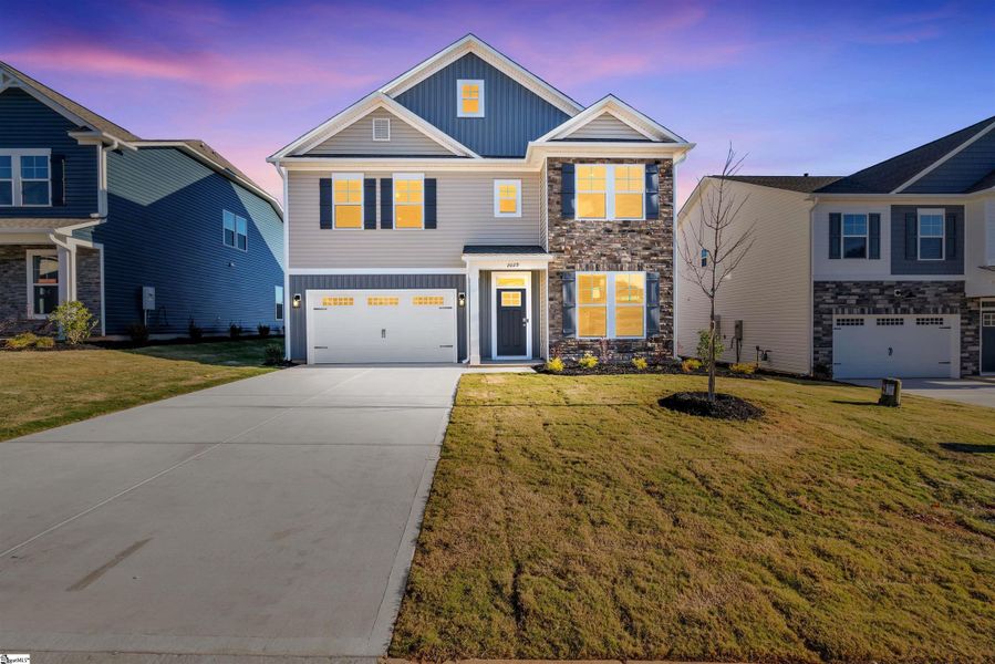 Front exterior of a new home in Halton Oaks, Spartanburg, SC, highlighting curb appeal (Image 19).