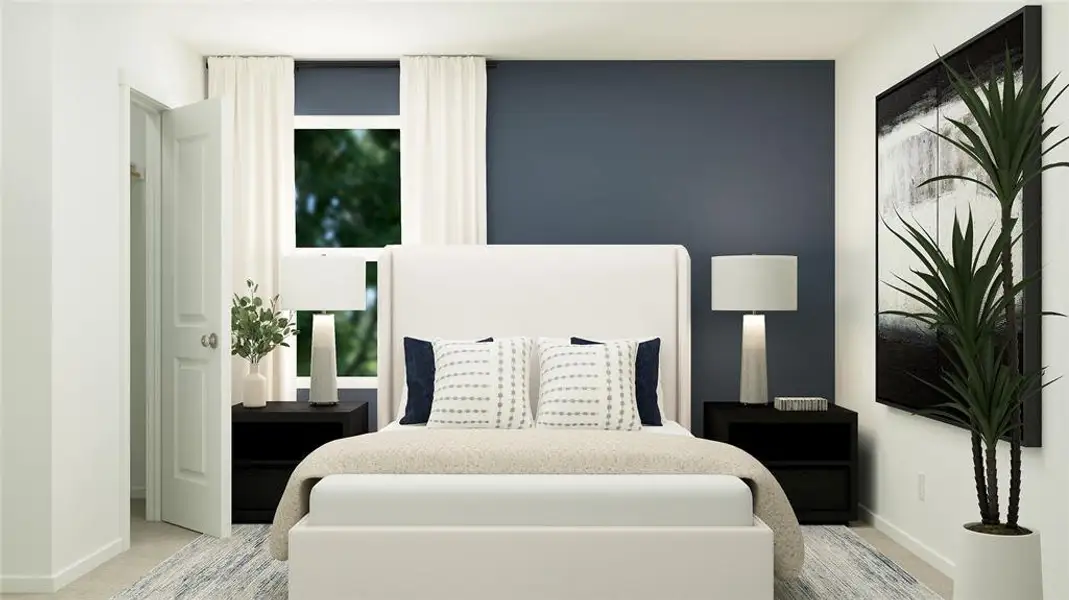 Bedroom featuring baseboards and light carpet Bedroom featuring baseboards and light carpet