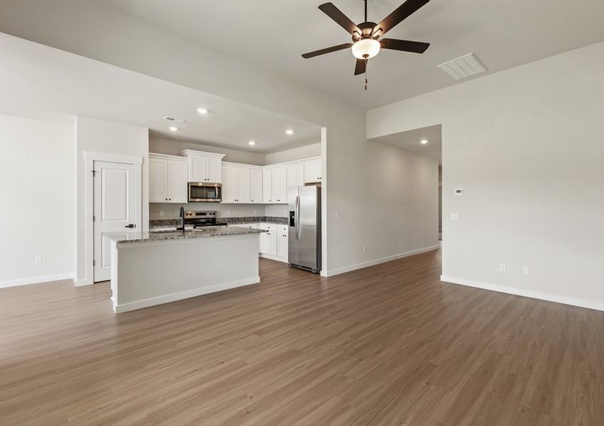 The kitchen opens to the living area