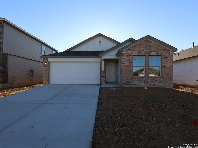 Front exterior of a new home in Agave, San Antonio, TX, highlighting curb appeal (Image 23).